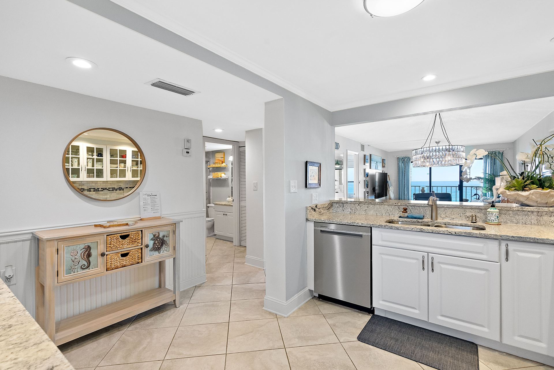 Kitchen and living room transition with ocean beyond