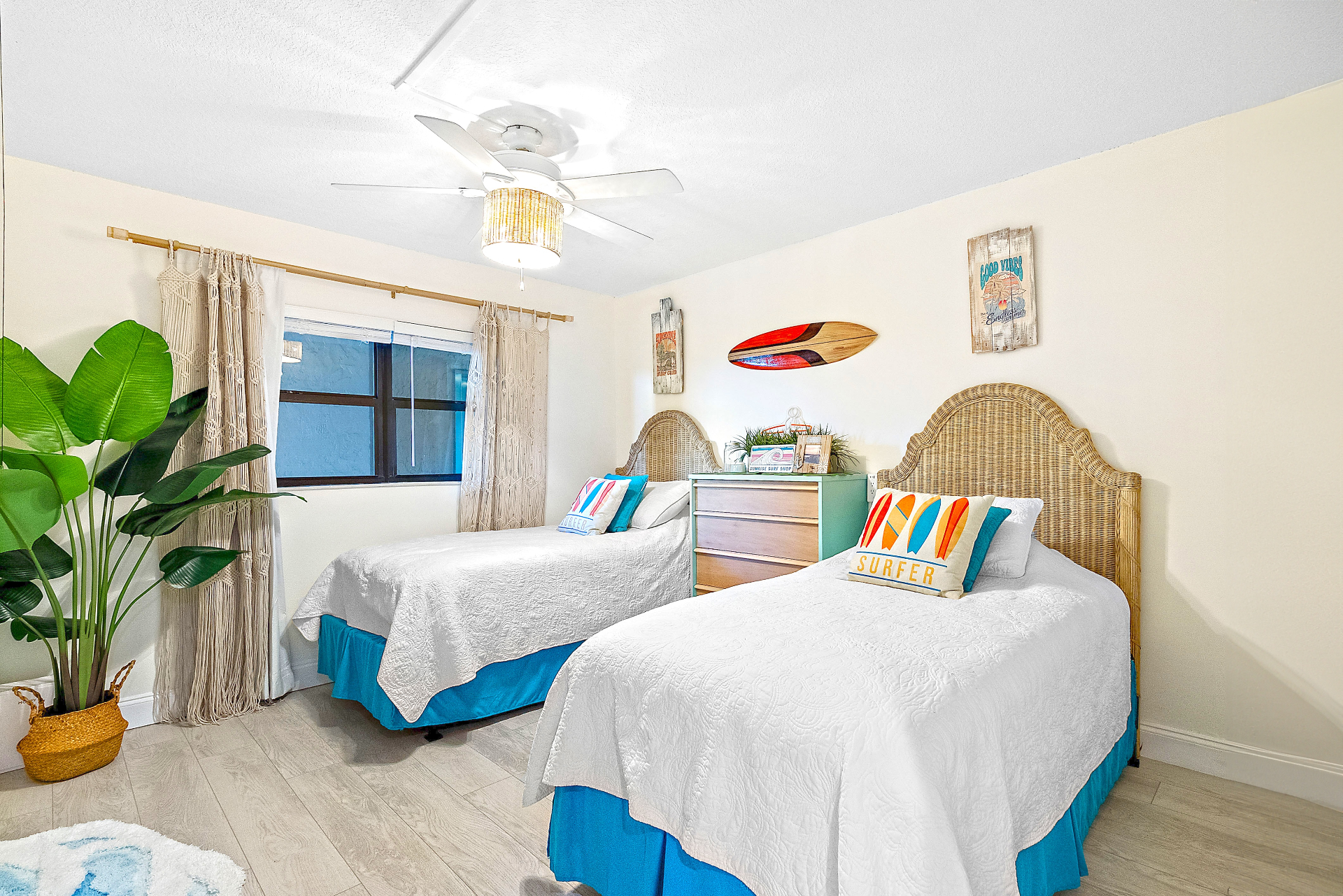 Luxury surf-themed guest room with twin XL beds
