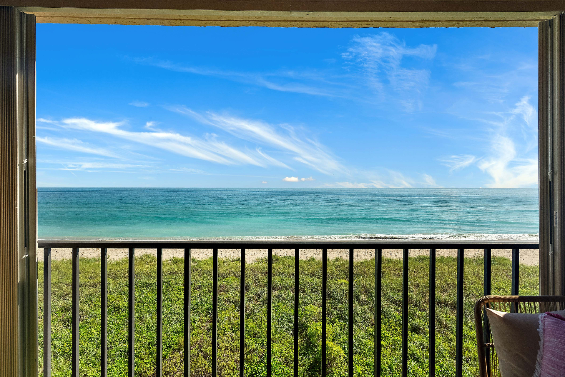 Miami-vibe patio with ocean and beach view
