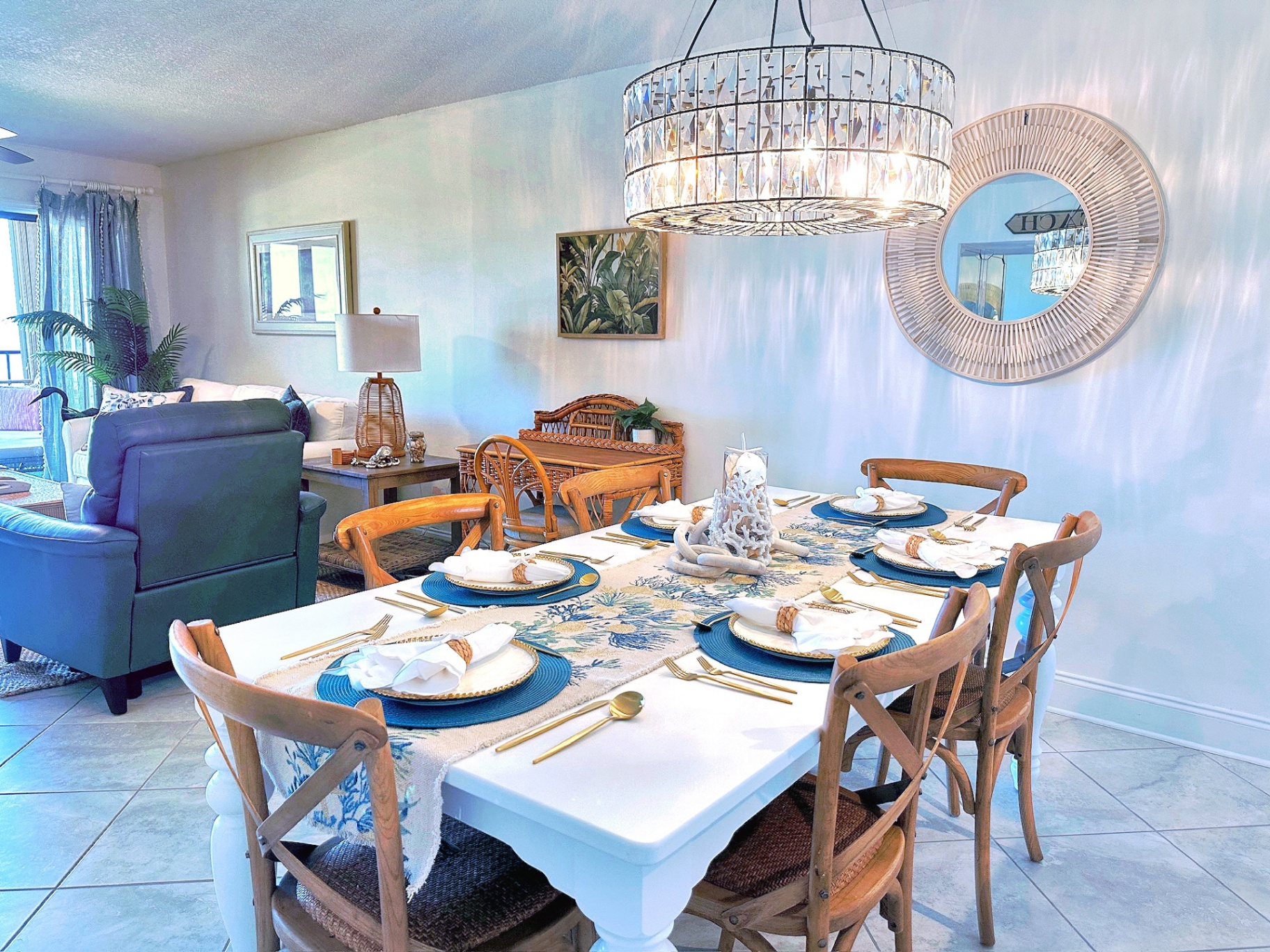 Elegant dining room with crystal chandelier at Our Beachfront Oasis