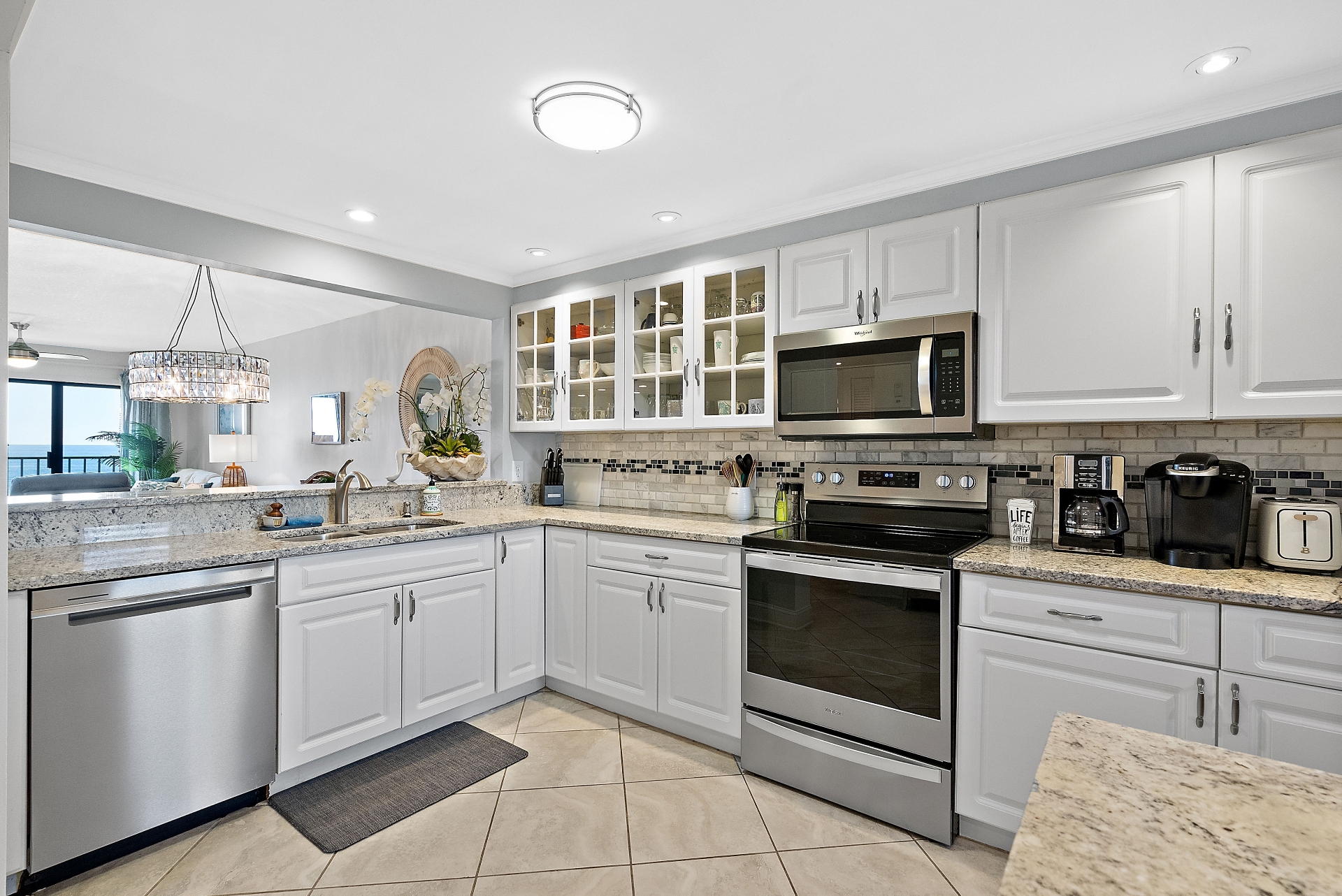 Modern white kitchen with granite counters